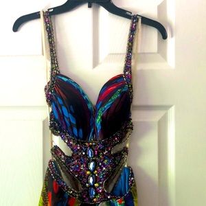 Jeweled dress with train,scarf and cut out sides and back. Size 6Jewel tones